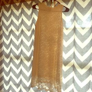 Sleeveless, white lace dress.